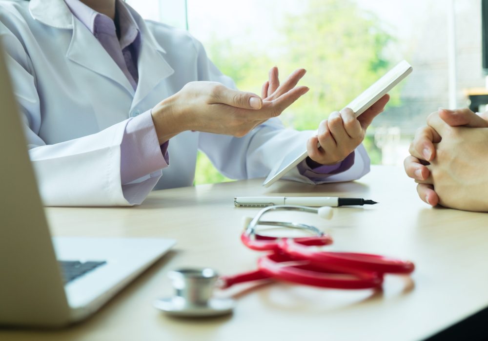 Doctor and patient are discussing something. Health care , Hospital and Doctor concept.